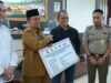 Pemerintah Kota Jambi Menyerahkan Uang Ganti Kerugian pengadaan Tanah Untuk Pembangunan Drainase Utama Revitalisasi Drainase Sungai Asam